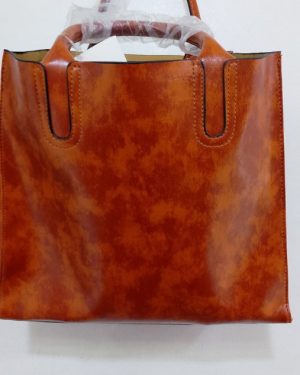 BOLSA COLOR LADRILLO TIPO CUERO $450